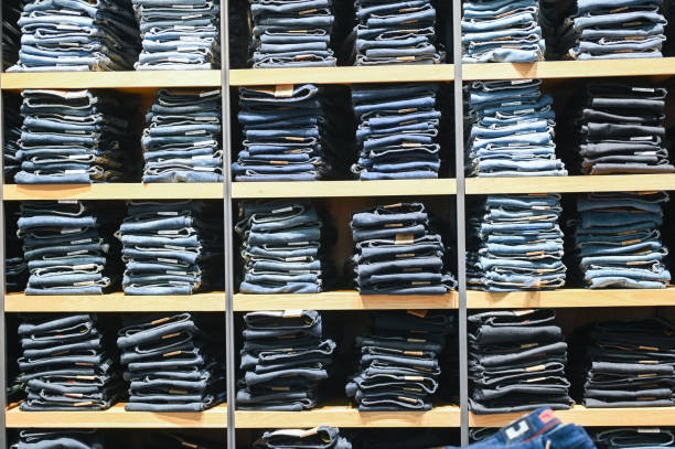 Shelf in the store with blue jeans